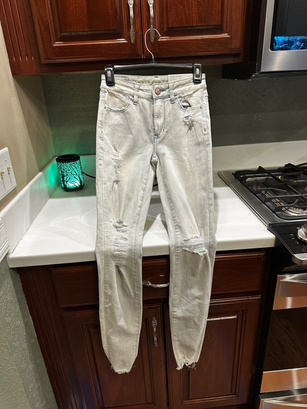 NWT American Eagle size 0 25W Light Wash Distressed Women’s Jeans